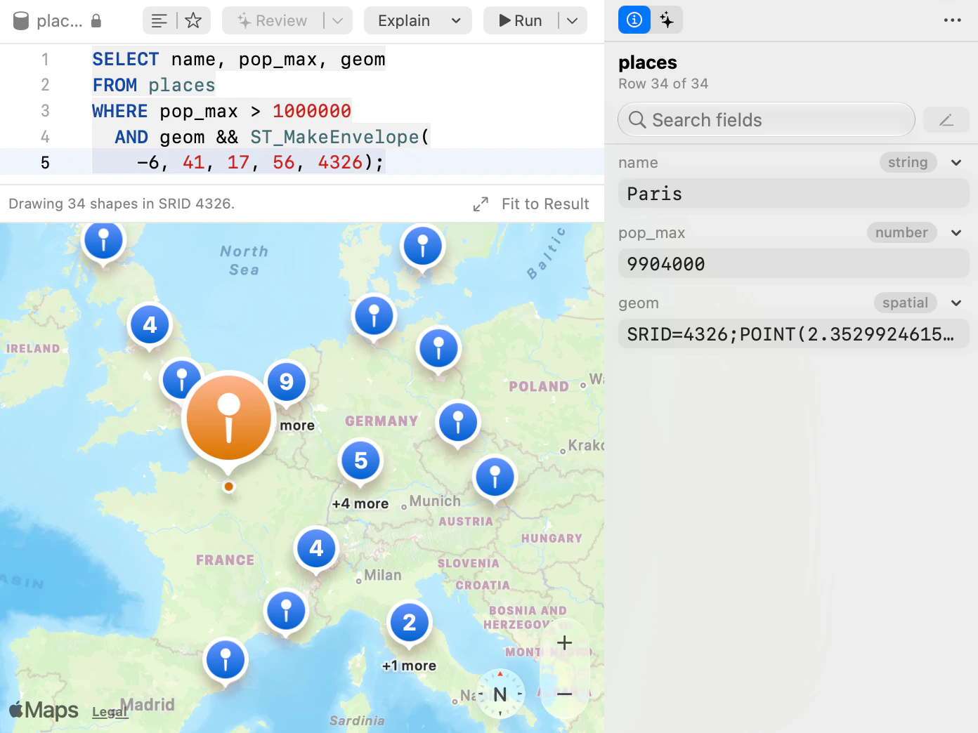 The Map view plotting populated places from a PostGIS table, with the selected point, Paris, in the row inspector.
